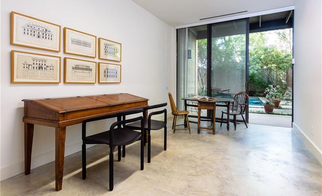 An office space downstairs opens to the tranquil backyard. 