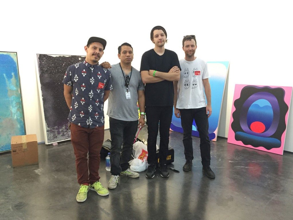 A scene from the Texas Contemporary 2015: The players at Cardoza Fine Art, including owner Pablo Cardoza (second from left). A good bet here were the Bret Shirley crystal-encrusted canvases (left), as well as works by Dual and Alika Herreshoff (right). The Fair was a boon to the independent Houston dealer, who reported brisk sales and interest in his artists and programming.