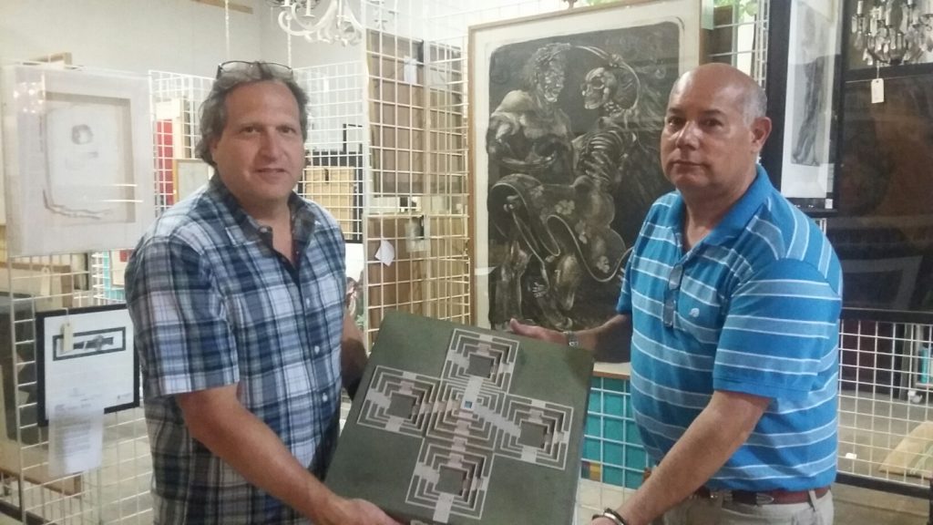 David Lewis and Ernest Maese gave us an advance preview of the lots. Shown here, the rare maquette for Moroles' Police Officer Memorial, and behind, an engraving by Texas artist Luis Jimenez, from the sculptor's personal collection.