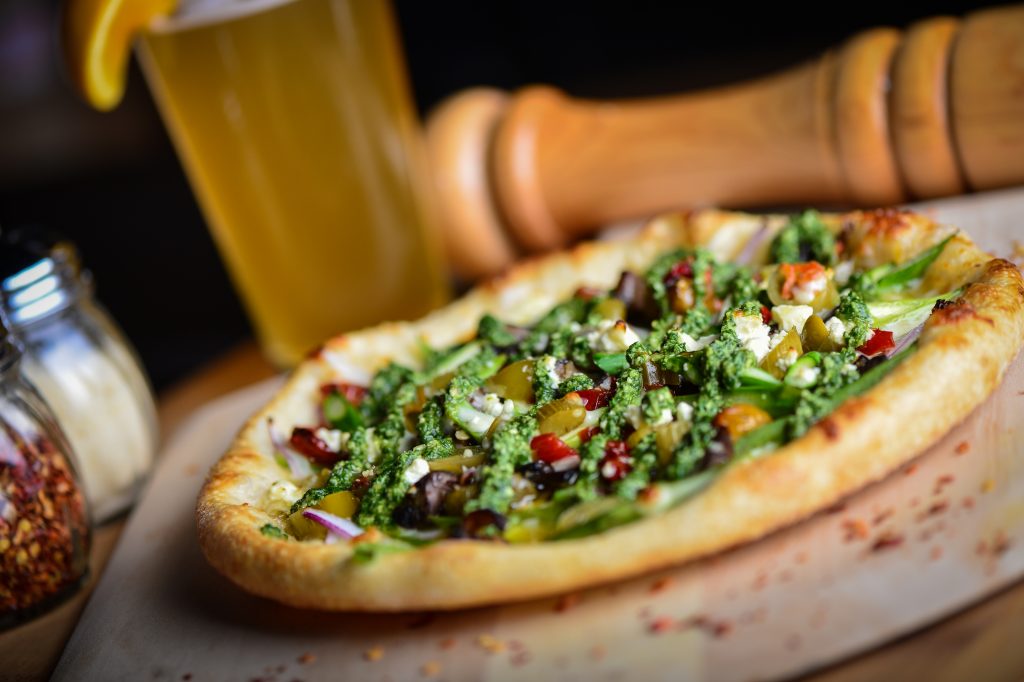 Bottled Blonde Pizzeria + Beer Garden is a delightful blend of Italian food with a communal German beer garden atmosphere.