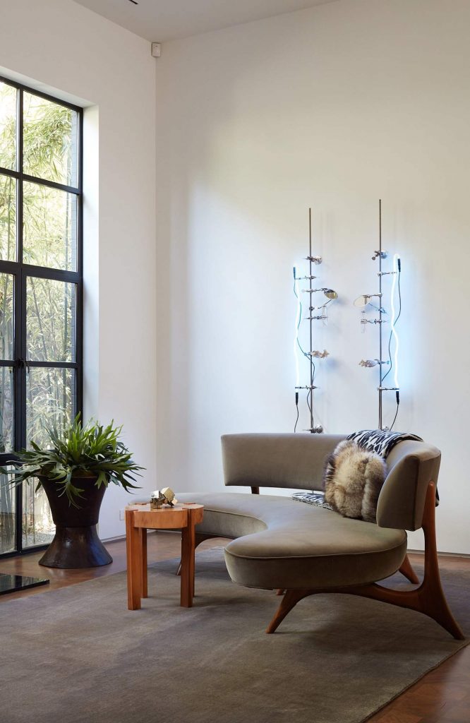 The minimalist decor is the perfect canvas for the couple's art collection. 