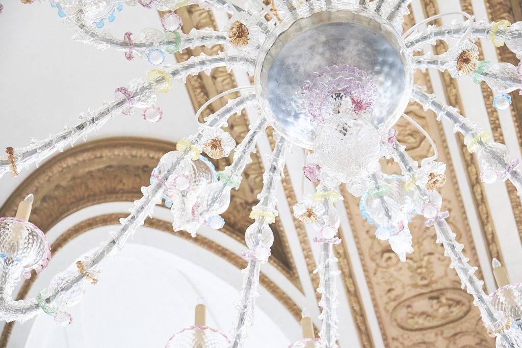 The dining room's twin Italian Murano Glass chandeliers were restored and lowered to a more prominent place. 