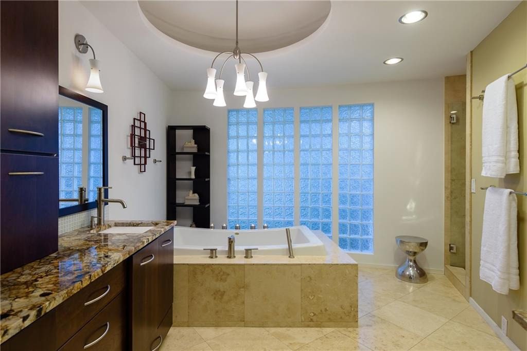 The master suite has a luxurious bathroom. 