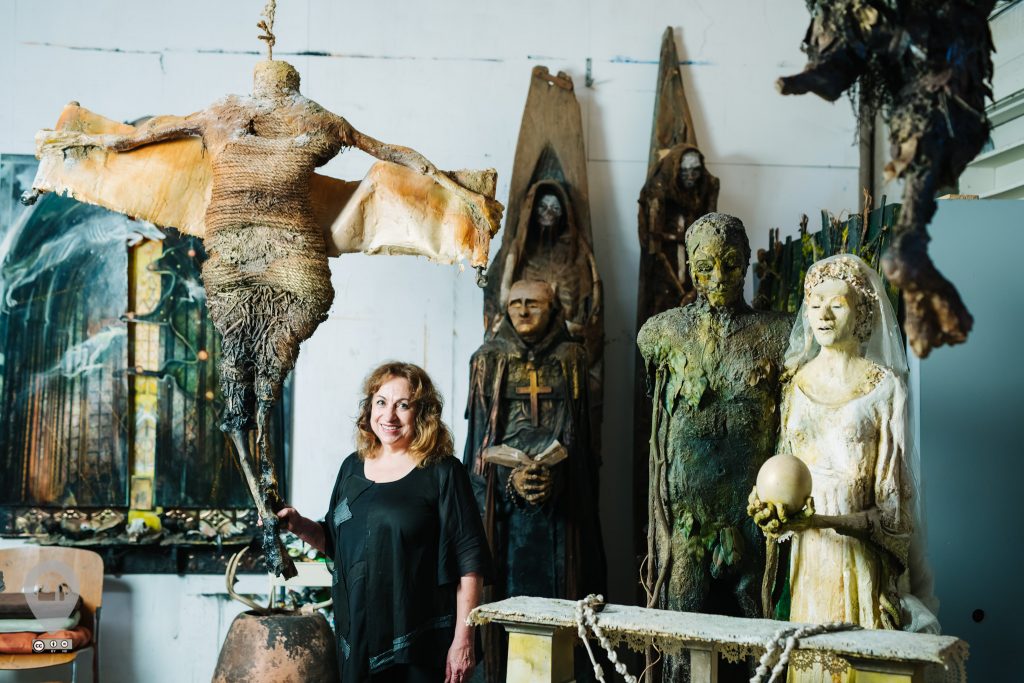Artist Sharon Kopriva's studio features her haunting sculpture throughout. 