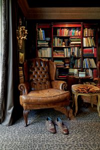 In the library, English tufted-leather chair, circa 1930. (Photo by Par Bengtsson)