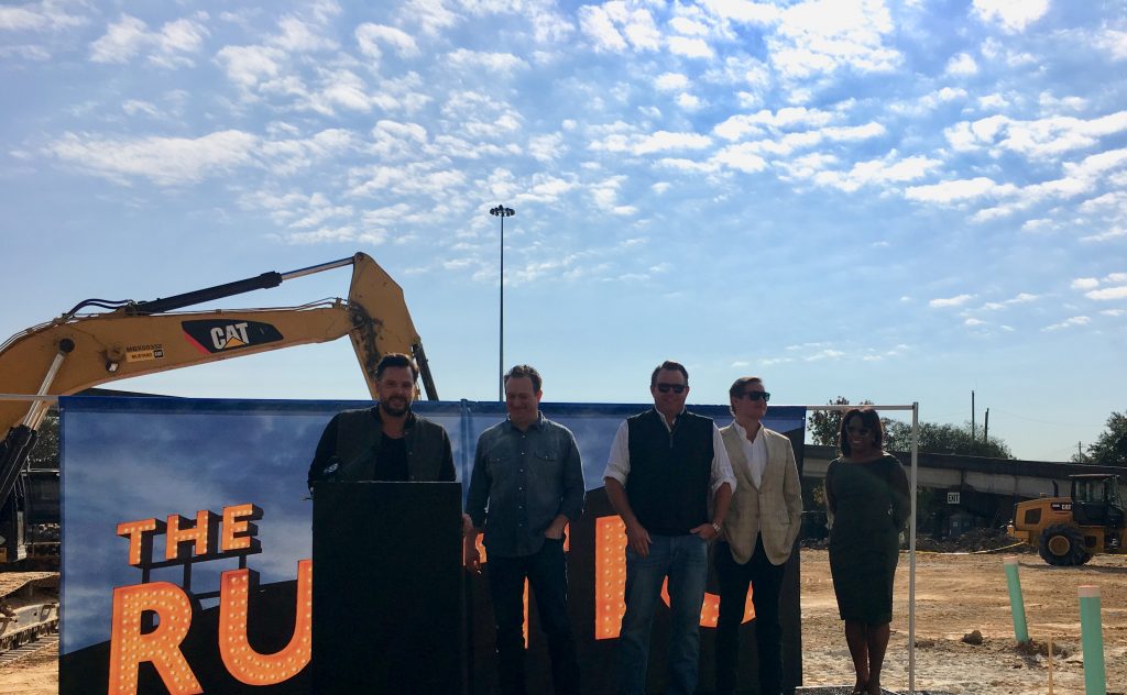 Kyle Noonan, co-founder of The Rustic, announces the groundbreaking. 