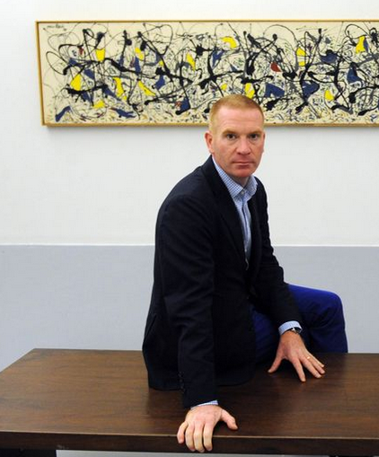 The DMA's departing top curator Gavin Delahunty shown in a 2015 photo with Pollock's "Summertime," 1948. (Photo Gavin Trafford, Liverpool Echo)