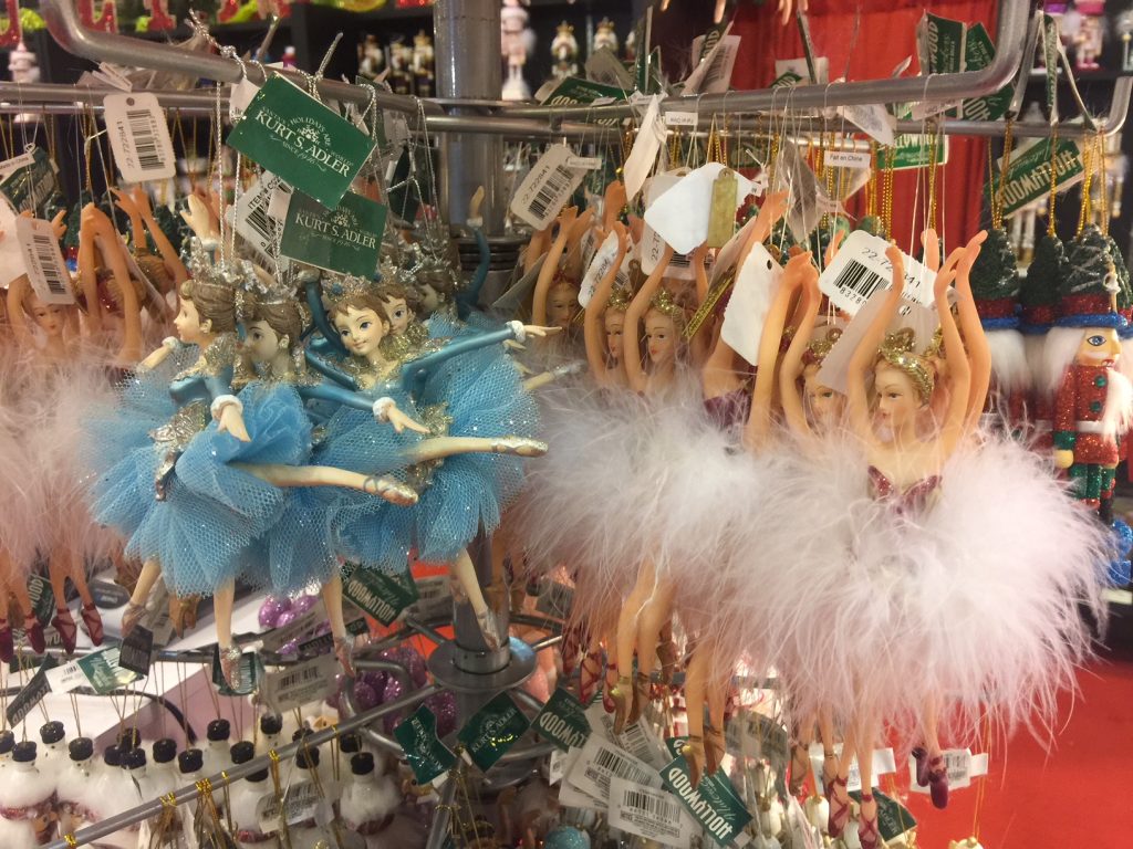 The Houston Ballet Barre booth features holiday ornaments including whimsical dancers.