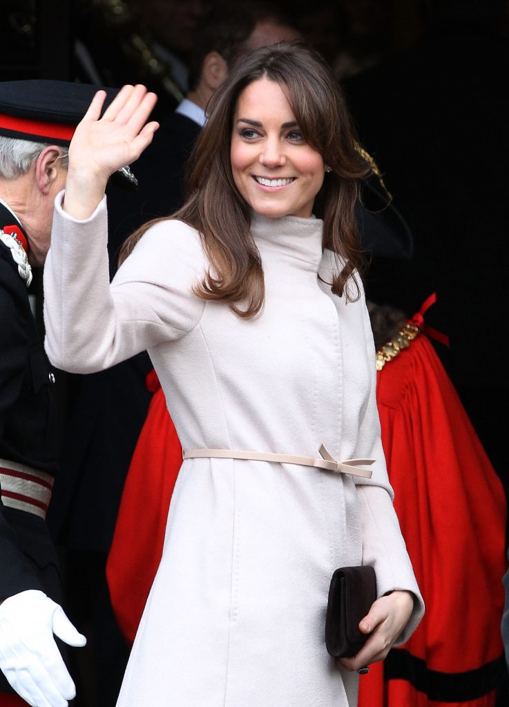 CAMBRIDGE, UNITED KINGDOM - NOVEMBER 28:  Catherine, Duchess of Cambridge waves to the crowds as she arrives at Cambridge Guildhall as she pays an official visit to Cambridge with Prince William, Duke of Cambridge on November 28, 2012 in Cambridge, England. (Photo by Danny Martindale/WireImage)