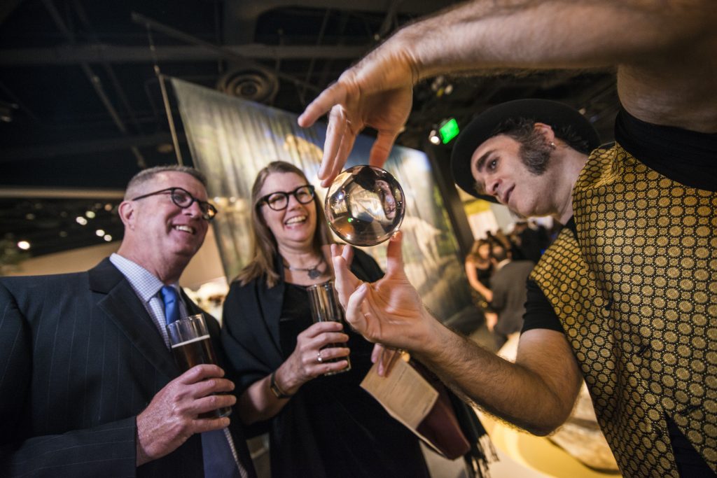 Magician with a mesmerizing glass gravity ball