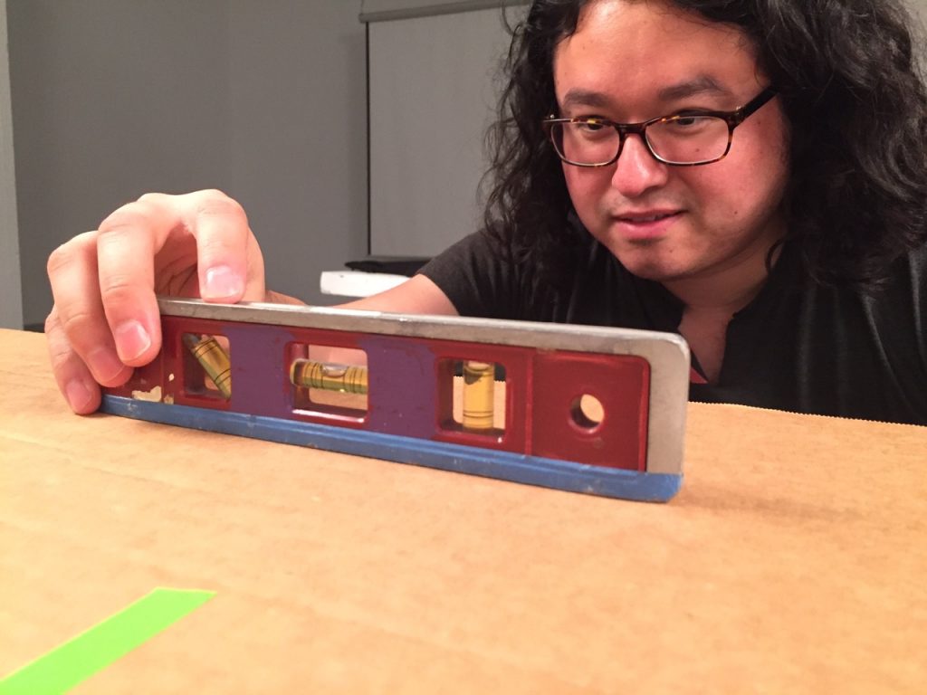 Recording my residence exhibition for posterity: Artpace archives associate Chris Castillo setting up the photo stand for documenting multiple works-on-paper.