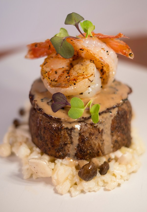 Bistro Menil's New Year's Eve special includes warm potato gratin with smoked salmon, topped with caviar, crème fraîche and chives. 