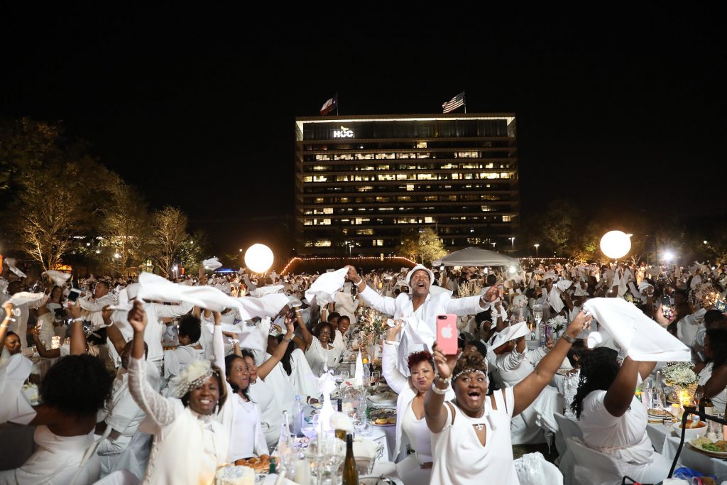 Traditional Le Dîner en Blanc napkin wave to commence dinner