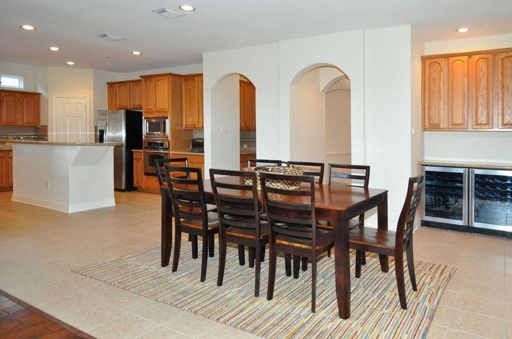 Twin high arches add a fun element to the dining room. 