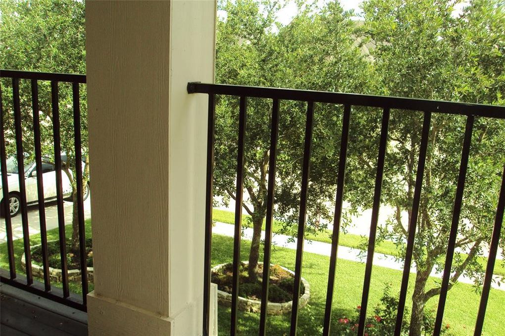 The second-floor balcony looks out into the green neighborhood. 

12207 Mossy Trail