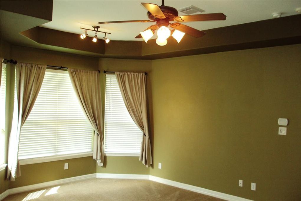 The moss green paint adds a rustic element to the contemporary house. 