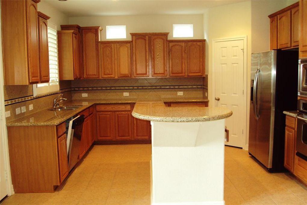 The kitchen island gives you a lot of room to prepare party hors d'oeuvres. 

12207 Mossy Trail 
