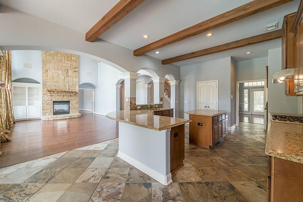 The home boasts both slate and wood floors. 

11801 Sea Shadow