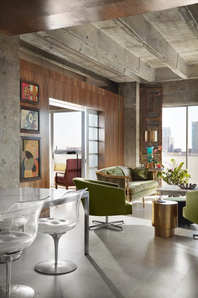 Custom walnut wall designed by Bentley Tibbs. Brass end table from Target. LaVerne chairs with original leather seats and marble Parsons table, both circa 1970.