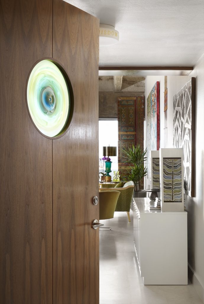 The entry’s solid walnut door was designed by Bentley Tibbs, with Jim Bowman’s blown-glass window. Pam Nelson’s Twin Tower stained-glass lamps, 2008.