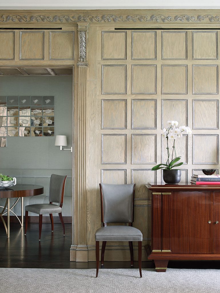 In the living area, century-old oak paneling was refurbished and silver-leafed by Christophe Pourny.