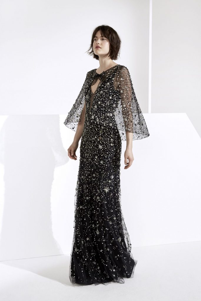 Jenny Packham galaxy black tulle gown with crystal starburst embellishments and matching cape.