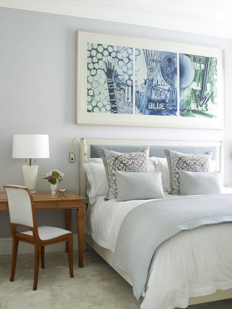 In the master bedroom, Holland & Sherry wool wall upholstery. Custom parchment-and-nickel bed with Brunschwig et Fils Florent silk-velvet inset panel. Linens by Nancy Stanley Waud. Chair from Maison Gerard Antiques. André Arbus desk. Alabaster lamp from Karl Kemp Antiques. Jasper Johns’ Untitled, 1998