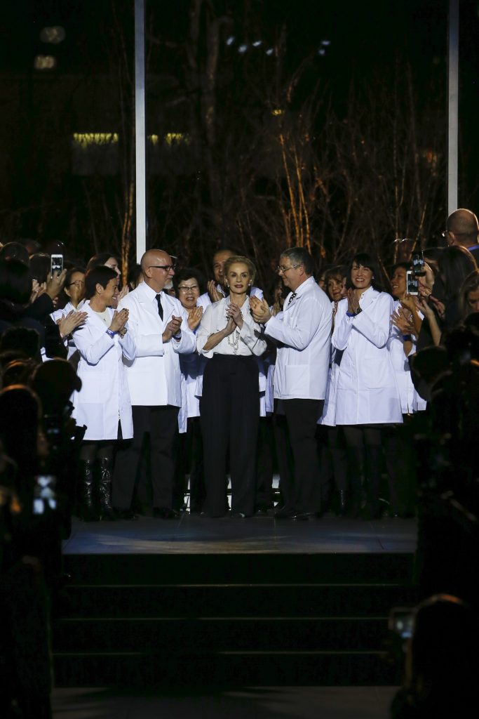Surrounded by staff, Carolina Herrera takes her final runway bow at New York Fashion Week. 