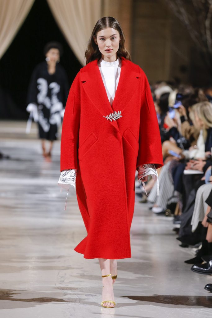 Oscar de la Renta crimson textured wool cashmere coat, silver and crystal pave leaf brooch.