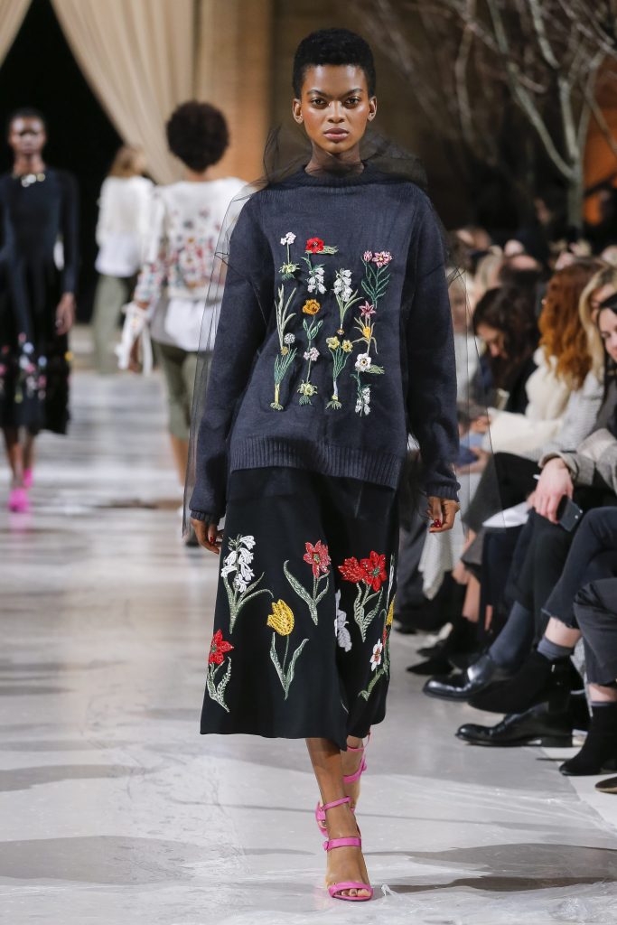 Oscar de la Renta charcoal crewneck sweater and black bonded stretch crepe  skirt with Mrs. Delaney floral embroidery.