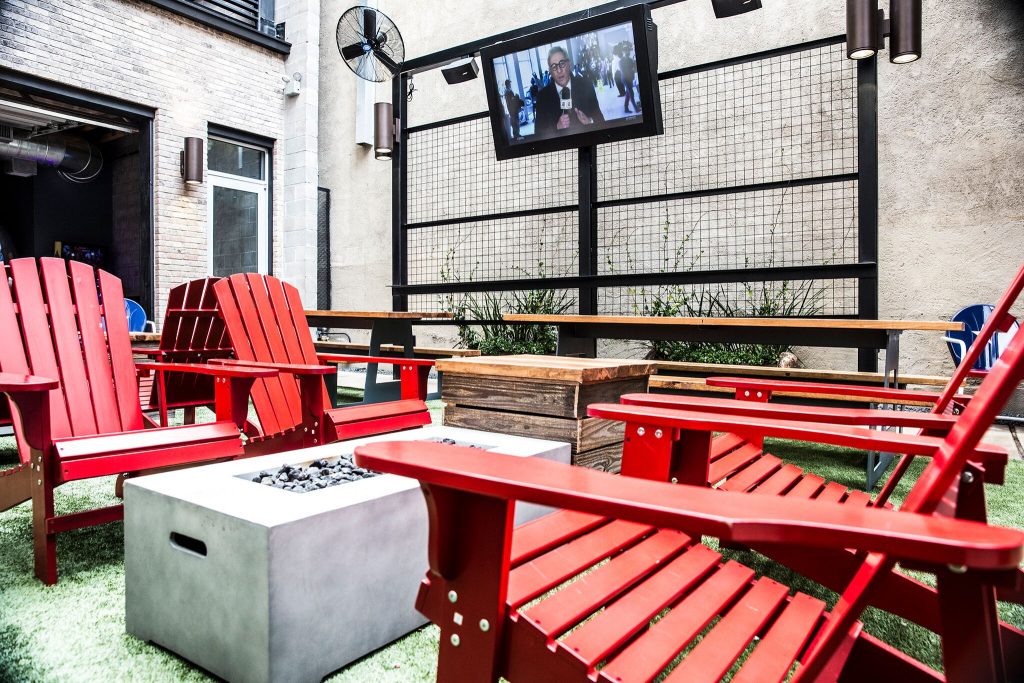 The backyard's Adirondacks are throwbacks to Cody Hasting's family gatherings in Katy. 