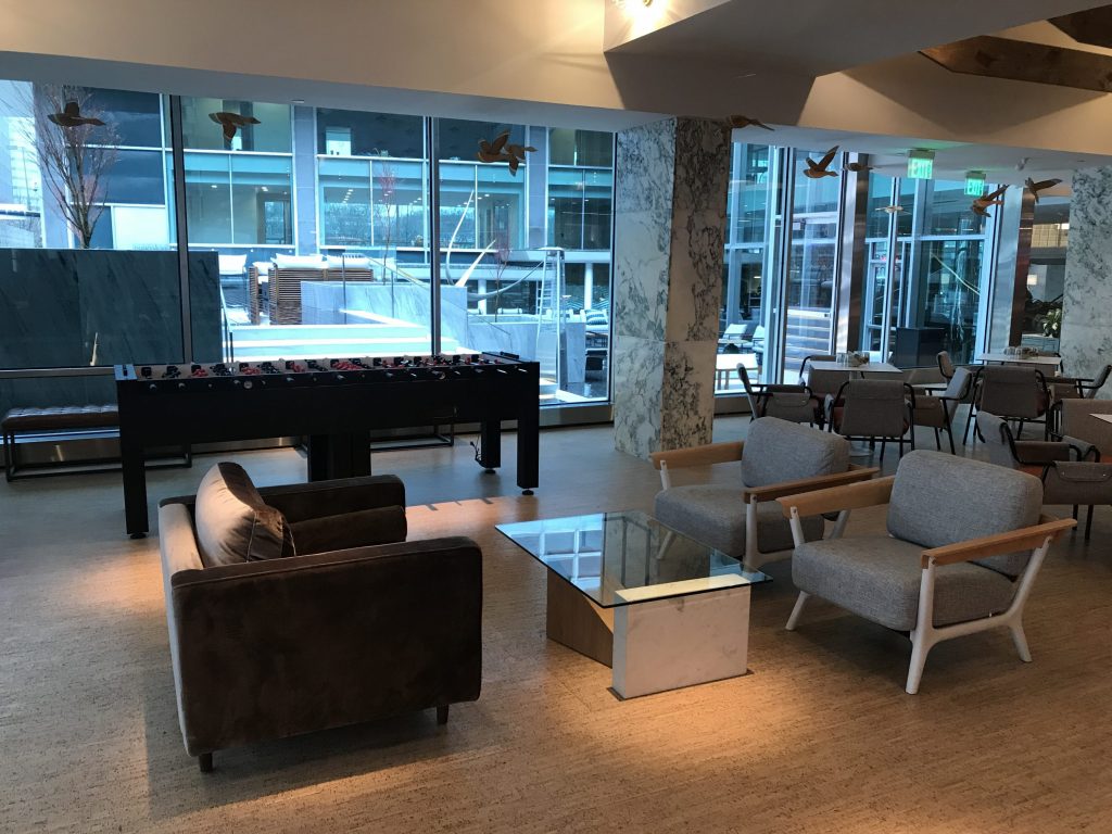 The space has foosball tables, ping pong tables and pool tables scattered throughout.