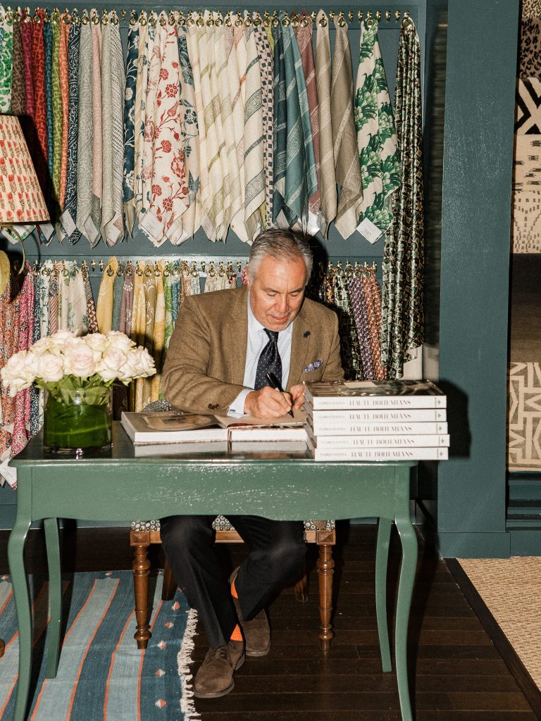 Miguel Flores-Vianna signs copies of his new book.