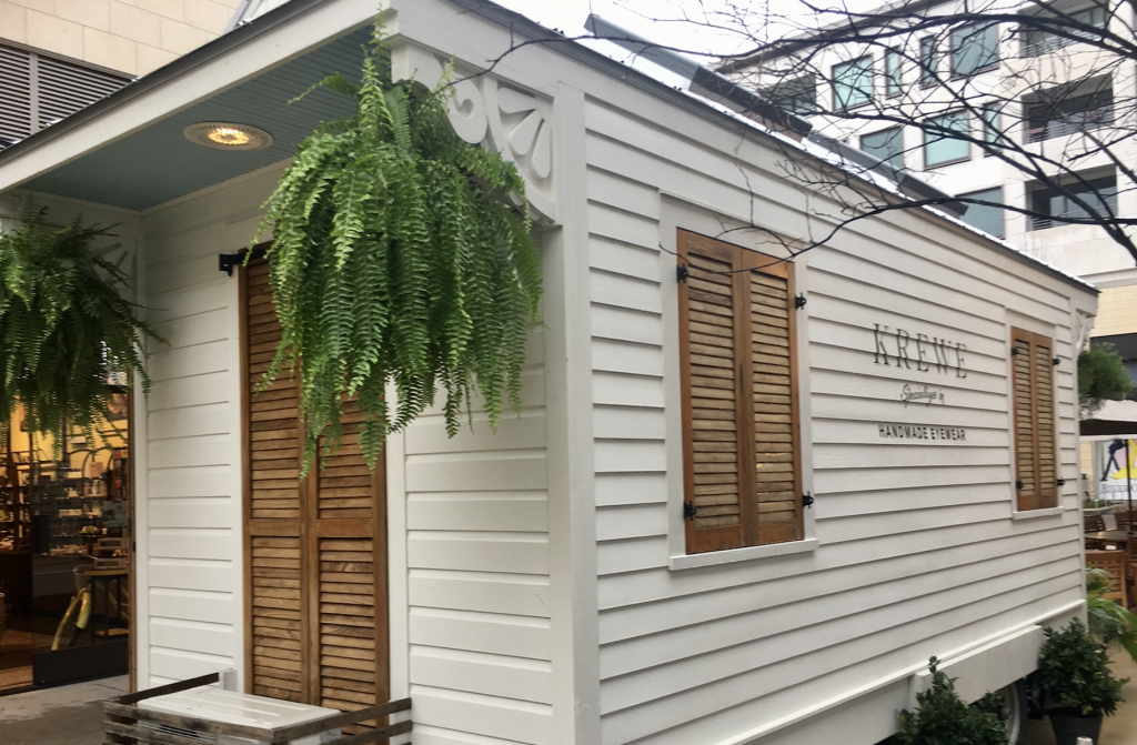 The KREWE Tiny House even has shutters and greenery.