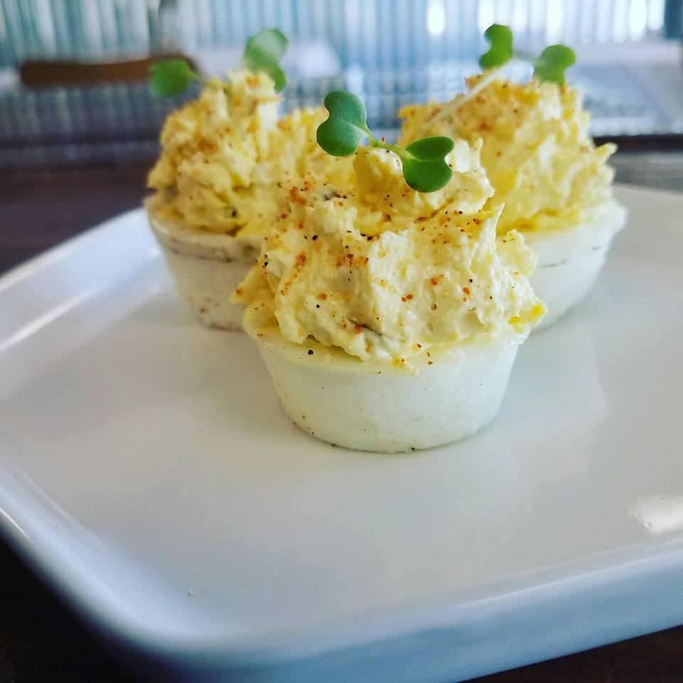These updated deviled eggs feature wasabi microgreens. 