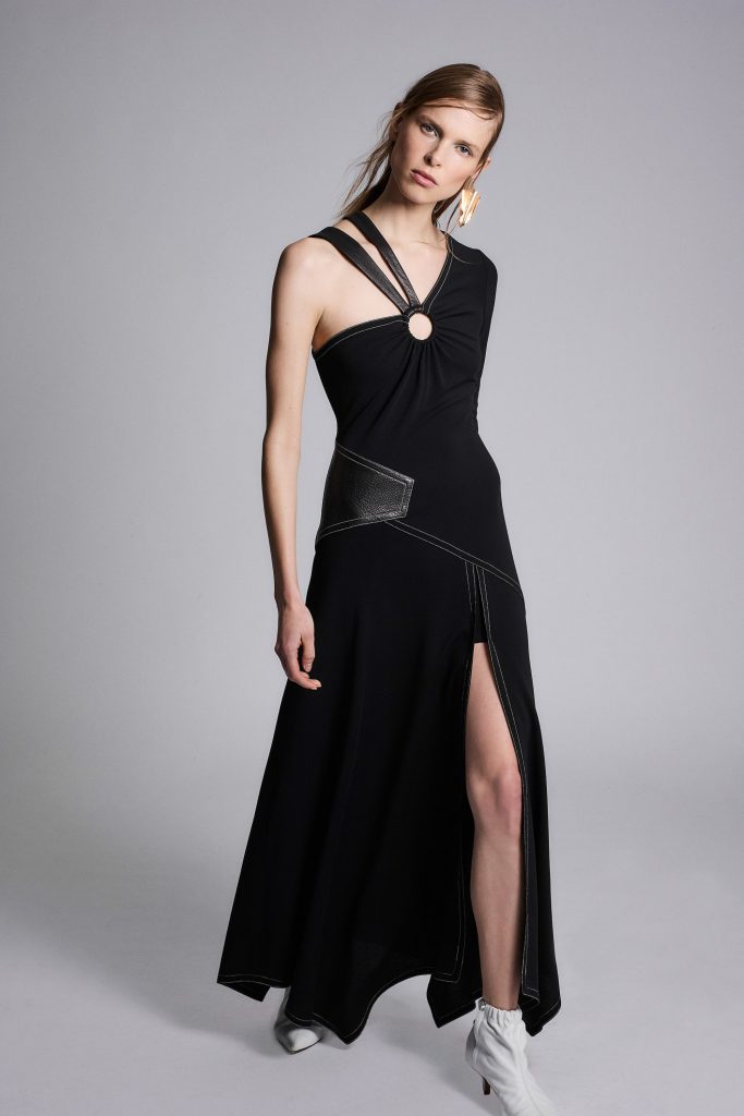 Yigal Azrouël  combines feminine and masculine elements in this black dress with above-the-knee slit and leather detail.