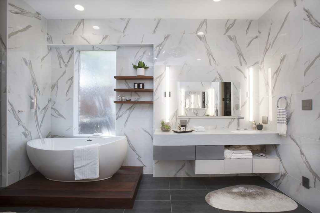 This spectacular bathroom from Joseph and Berry features 24' polished porcelain marble tiles from floor to ceiling and a custom floating vanity (made in Europe) giving the space a modern yet elegant feel. 