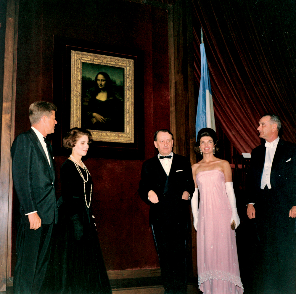 President Kennedy, Madame Malraux, Andre Malraux, Mrs. Kennedy, and Vice President Johnson unveil the Mona Lisa at the National Gallery of Art, Washington, D.C.  (Photo Courtesey Robert Knudsen/John F. Kennedy Presidential Library, Boston.)