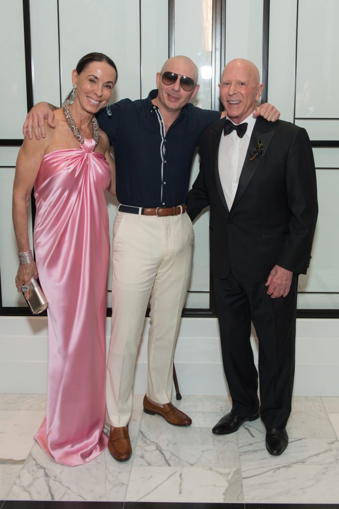 Sue Smith, Pitbull, Lester Smith at the Houston Children's Charity gala in 2018