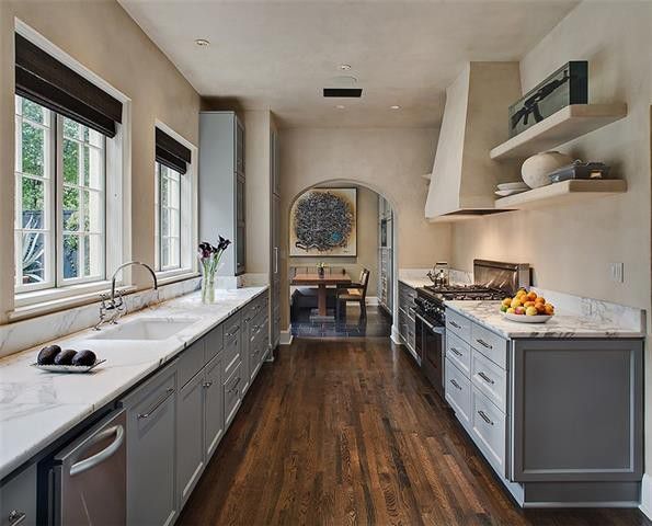 The kitchen features marble countertops. 