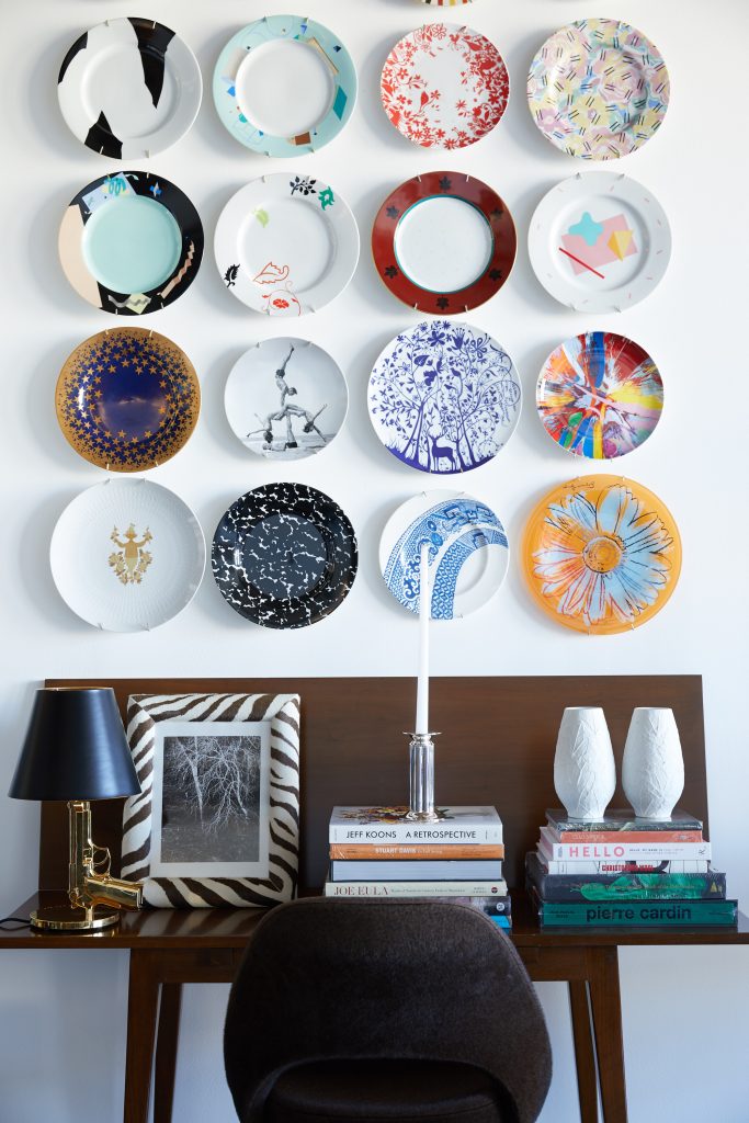 Vintage plates designed by Robert Venturi, Steven Holl,
Ettore Sottsass, Michael Graves, Tord Boontje, Damien Hirst, and Jeff Koons, among others. Edward Wormley folding table from reGeneration, NYC. Philippe Starck Gun lamp for Flos. Tree photograph by Doug Brightwell. Robert A.M. Stern
Century candlestick for Swid Powell. German Heinrich white
bisque leaf vases.