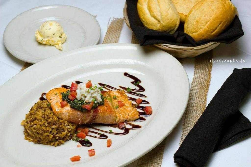 French Quarter Grille brings cajun comfort to seafood, like this proscuitto-wrapped and grilled French Quarter Salmon. (Photo by French Quarter Grille.)