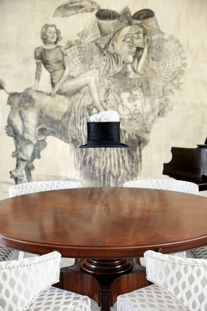 Wolfe Von Lenkiewicz’s "Dora", 2009, and Polly Morgan’s "White Rabbit on a Top Hat", 2007. Chairs from Dean Martin’s Palm Springs estate.