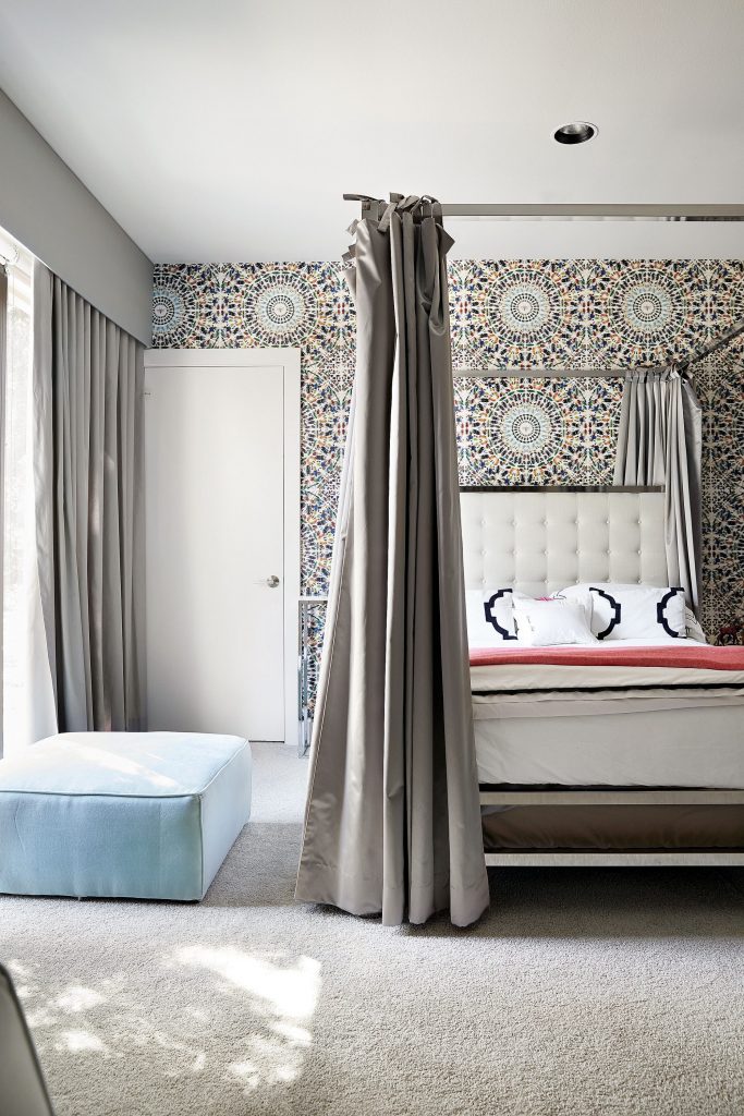 In the daughter’s bedroom, Damien Hirst’s "Etymology Wallpaper", 2010. Pottery Barn Teen ottoman.