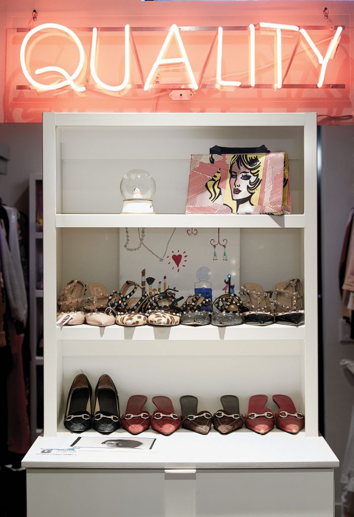 Kristy’s collection of shoes and bags. Alejandro Diaz’s neon "Quality", 2012.