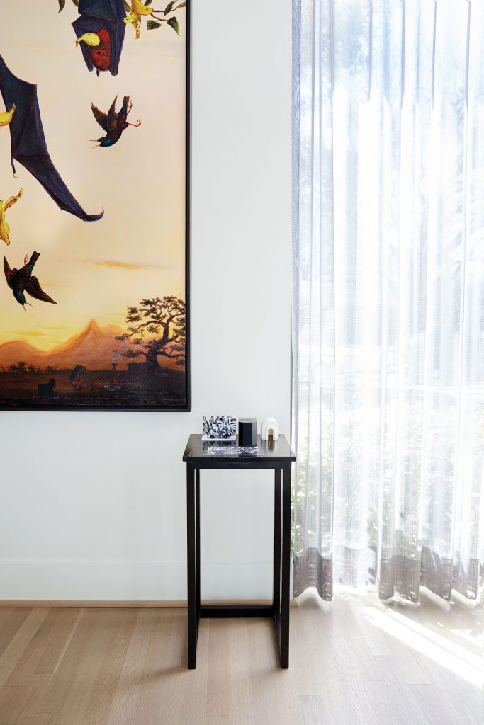 In the living room, Walton Ford’s "Moksha", 1997. On table, Francisco Moreno’s maquette of a Datsun Z from his 2015 performance installation.