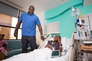 Shaquille O'Neal and Matt Iseman brighten the afternoon for patients at Texas Children's Cancer Center.