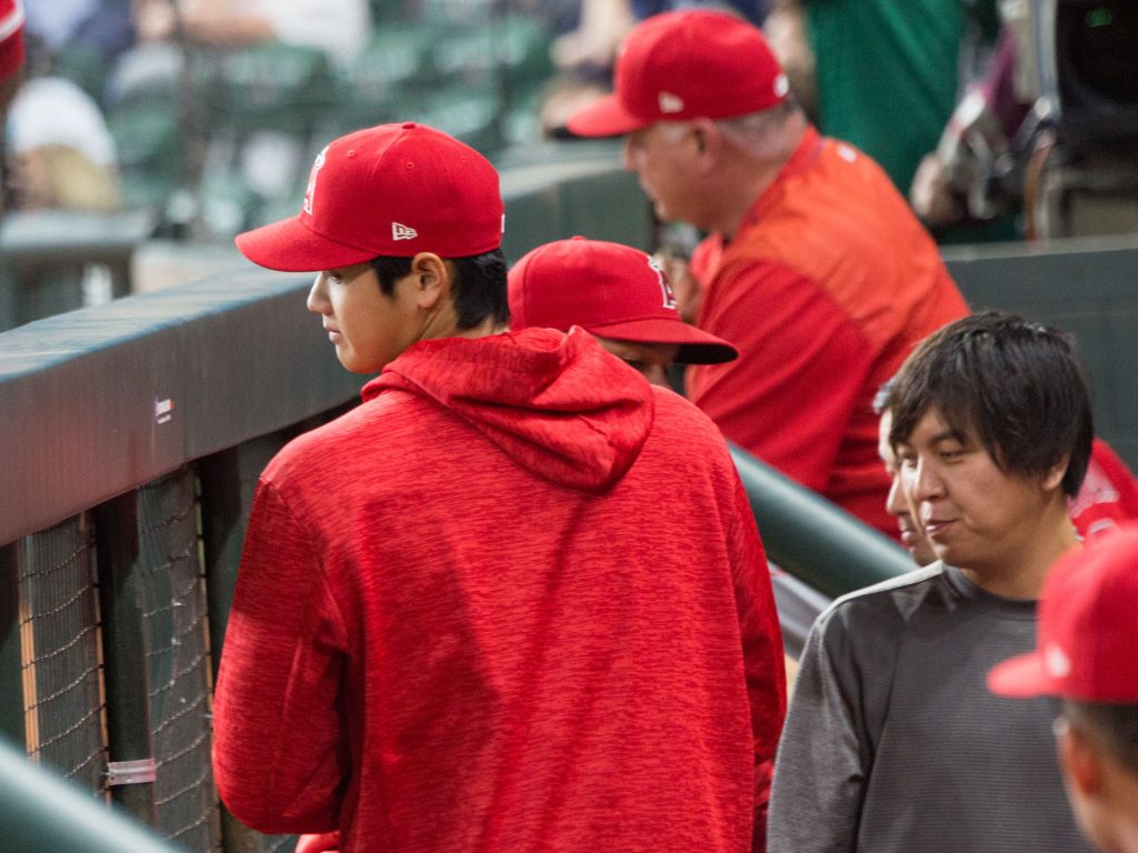 Shohei Ohtani's interpreter (Ippei Mizuhara, the man in gray) is seldom far from his side.