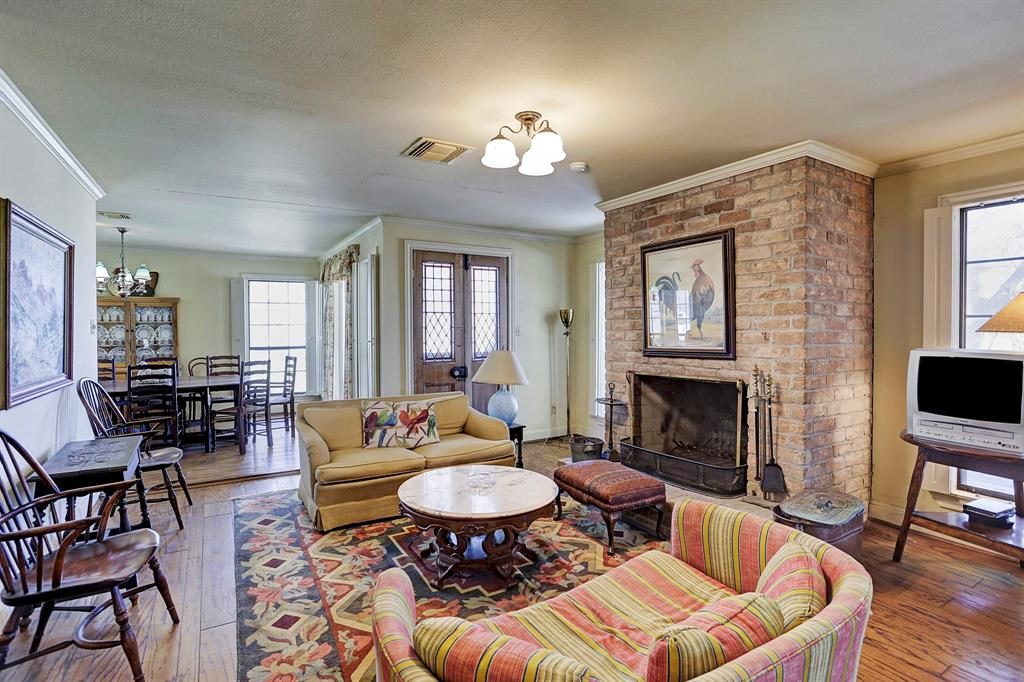 The brick fireplace is a rustic touch. 