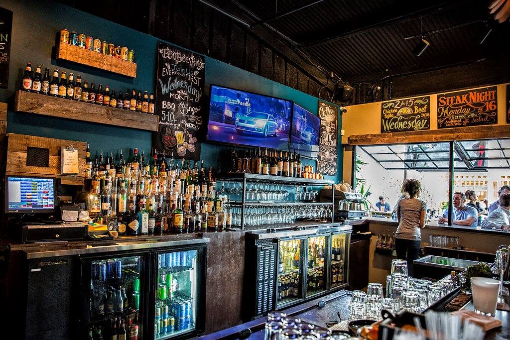 Down the Street wanted to be a neighborhood bar. Now it finds itself clashing with some of its neighbors.